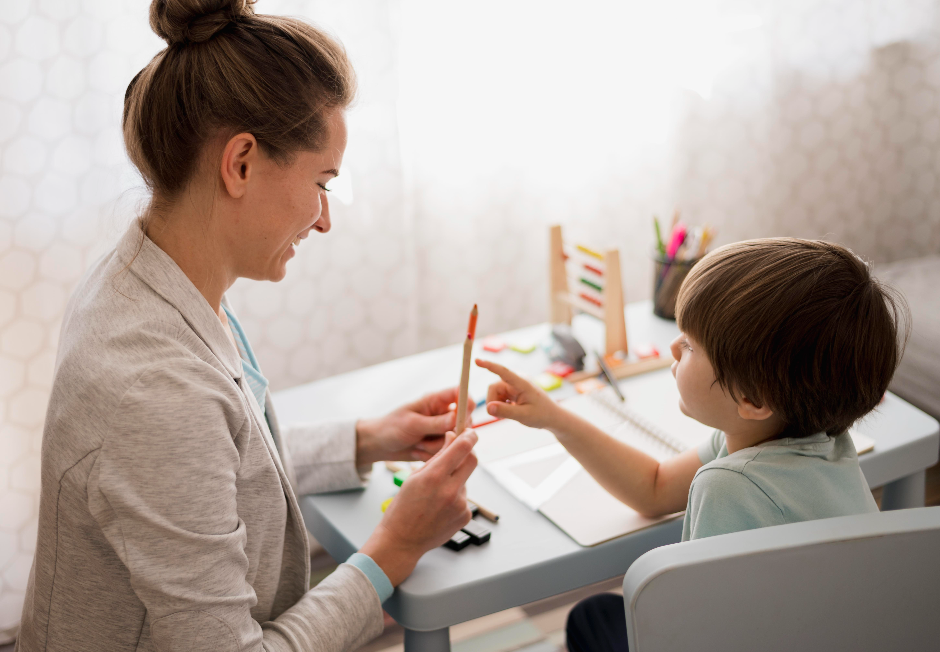 Speech therapist working with a young child
